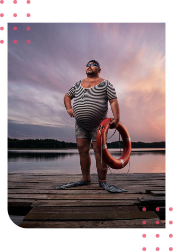 man near a lake with a lifebuoy