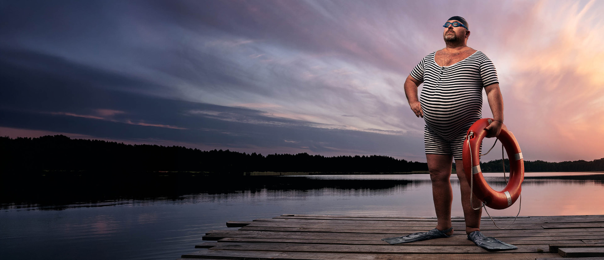 Badringsgubbe med livboj på brygga